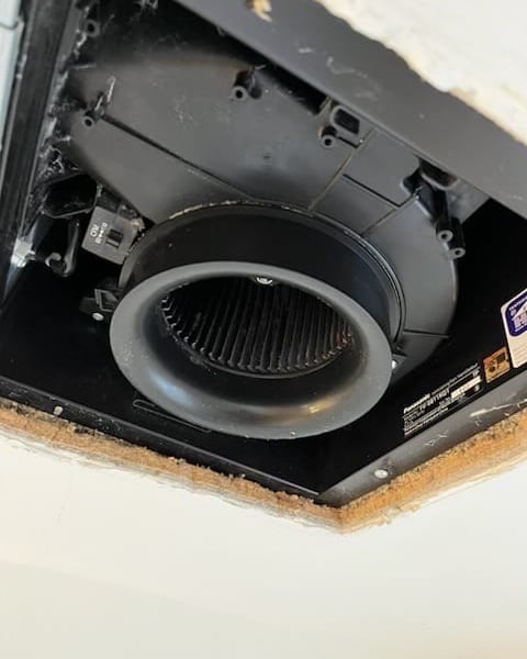 Clean bathroom fan housing after detail cleaning.